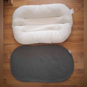 Snuggle me organic/infant lounger pillow with dark grey cover.